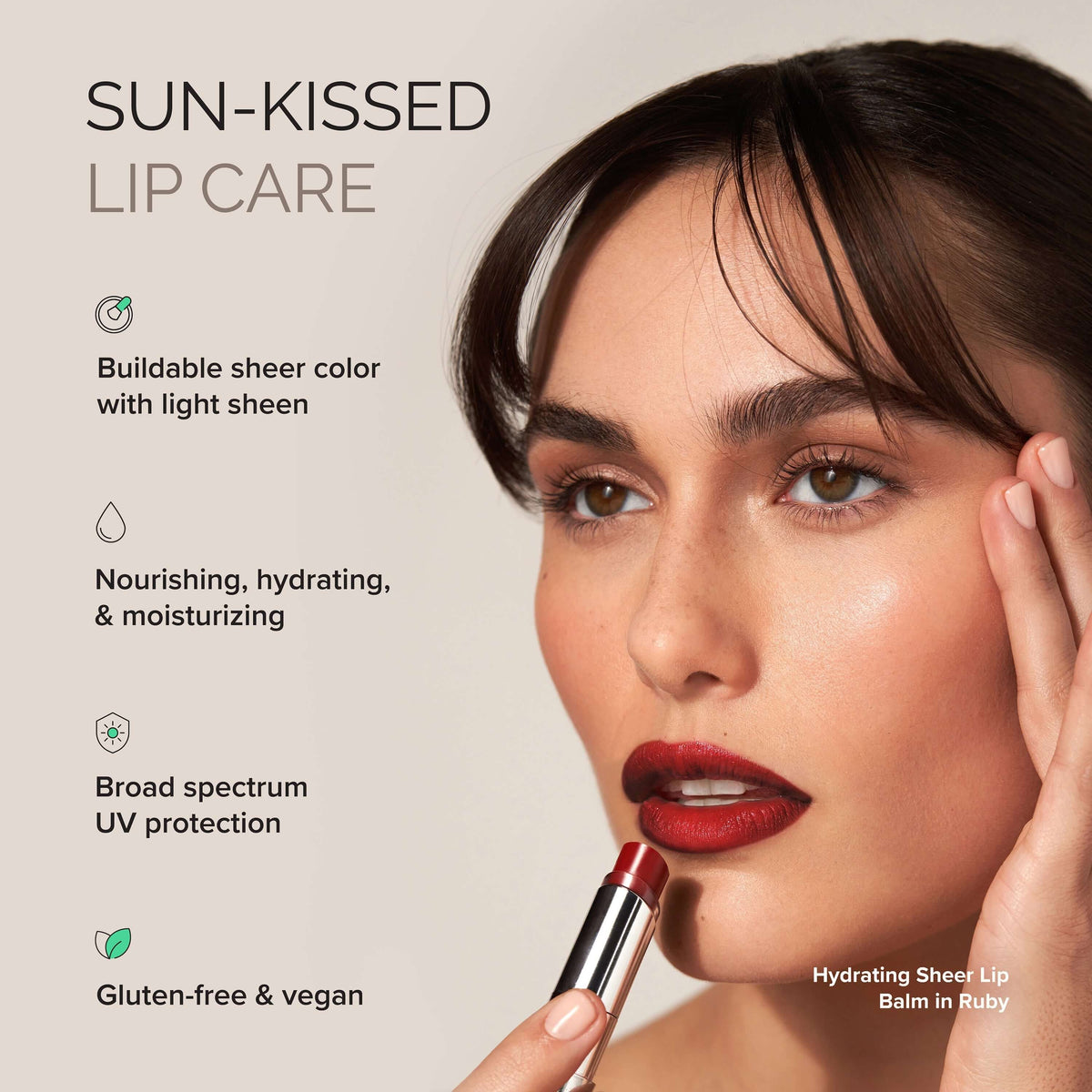 Model applying Hydrating Sheer Lip Balm SPF 30 in Ruby for nourishing, hydrating lip care with sun protection.